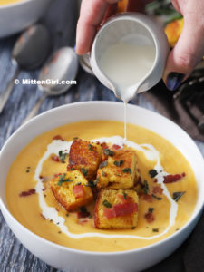 soup with croutons and drizzling of sauce