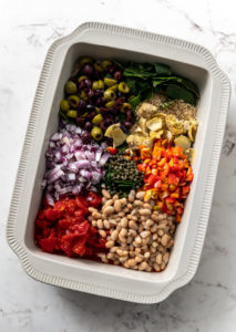 bakeware filled with chopped veggies