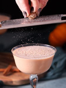 cocktail in a glass with zesting of spices