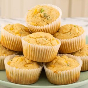 stack of 8 cornbread muffins on a plate