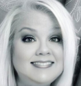 lady with blonde hair in black and white