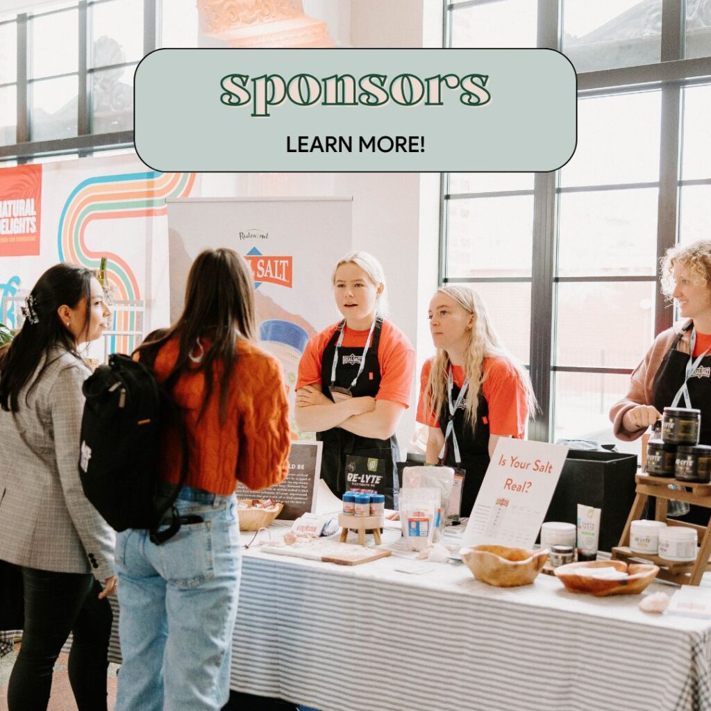 Several people interacting at a sponsor booth during a conference. The booth features products and displays from a food-related brand. The text above reads: "Sponsors – Learn more!"