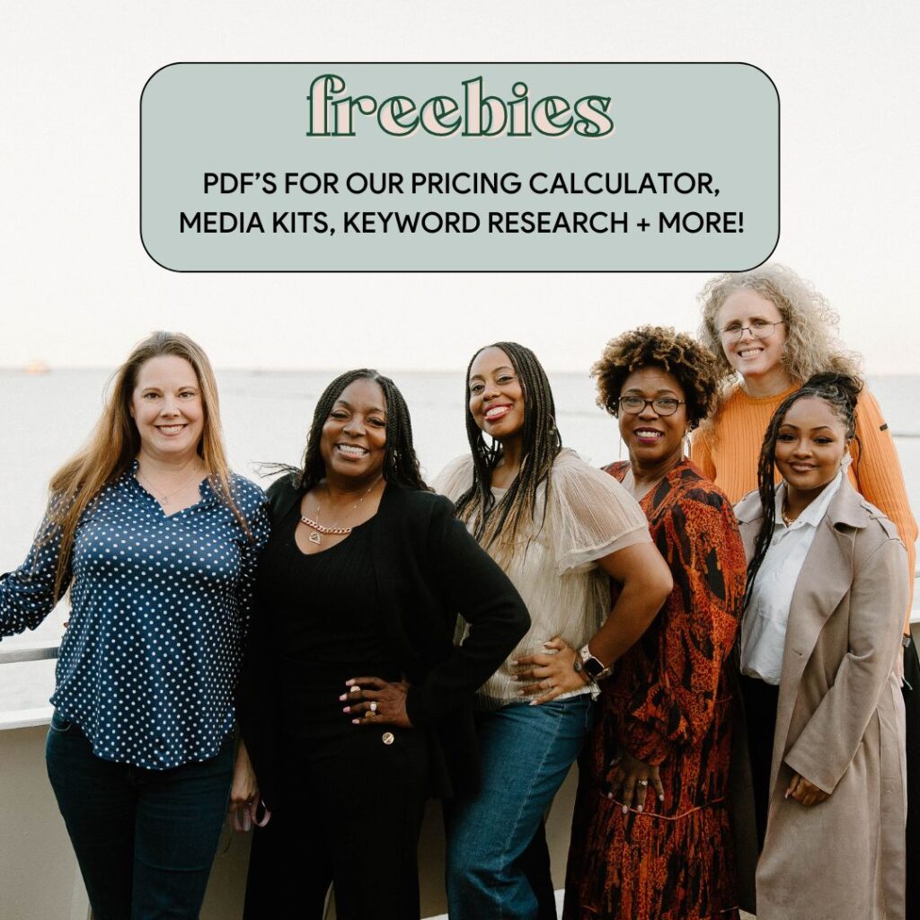 A group of six diverse women standing together, smiling towards the camera in an outdoor setting by the water. The text above them reads: "Freebies – PDF’s for our pricing calculator, media kits, keyword research + more!"